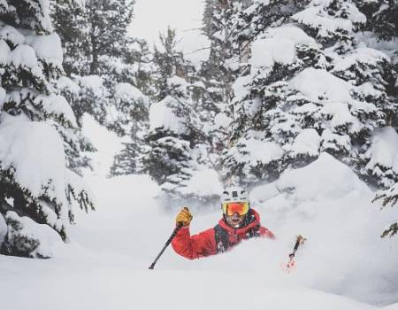 skier waist deep in powder