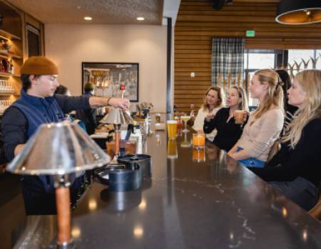 Women sitting at Trapper's bar