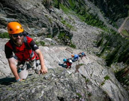 A guy climbing a mountain