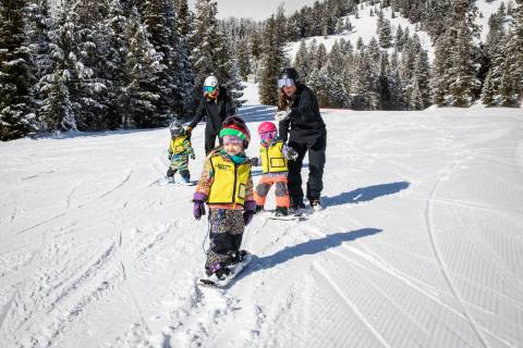 Kids snowboarding at Jackson Hole Mountain Resort