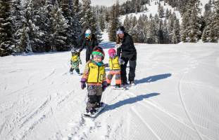 Kids snowboarding at Jackson Hole Mountain Resort